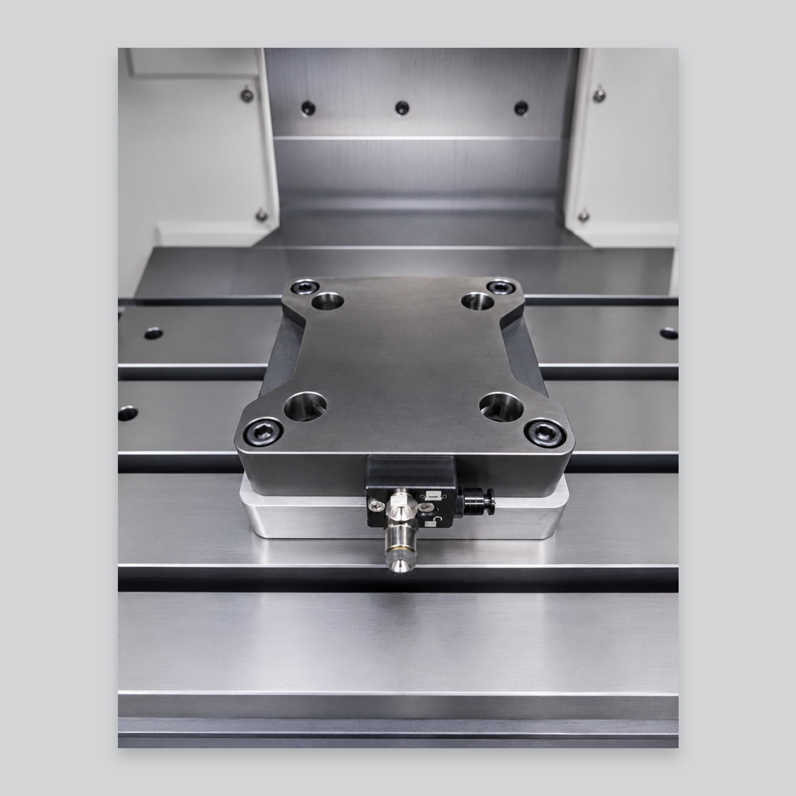 PB-A-AS-01 pneumatic quick-change workholding base fitted to a CNC machine table